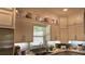 Bright and spacious kitchen showcases white cabinets, granite countertops, stainless steel appliances, and tiled backsplash at 104 Waccamaw Dr, Summerville, SC 29485