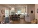 The open kitchen features white cabinets, granite countertops, stainless steel appliances, and an island with bar seating at 104 Waccamaw Dr, Summerville, SC 29485