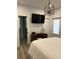 Serene bedroom features a vanity, tv and ensuite bathroom with glass shower door at 104 Waccamaw Dr, Summerville, SC 29485