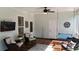 Comfortable screened porch with seating, TV, porch swing, and ceiling fan at 104 Waccamaw Dr, Summerville, SC 29485