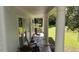 Inviting covered porch with brick flooring and comfortable seating at 104 Waccamaw Dr, Summerville, SC 29485