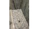Detailed shower floor features stylish grey and white mosaic tile, adding a touch of sophistication at 104 Waccamaw Dr, Summerville, SC 29485