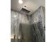 Contemporary shower with rainfall shower head and beautiful marble tile creates a luxurious experience at 104 Waccamaw Dr, Summerville, SC 29485