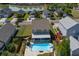 Aerial view of a two-story home featuring a backyard with a pool, landscaping, and a screened porch at 1097 Briar Rose Ln, Ladson, SC 29456