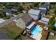 Aerial view of a two-story home featuring a backyard pool with a slide and a screened porch at 1097 Briar Rose Ln, Ladson, SC 29456
