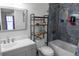 Bathroom featuring single sink vanity and a shower and tub with blue accent tiles at 1097 Briar Rose Ln, Ladson, SC 29456