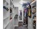 Walk in closet with a mirror and white shelving units and hanging racks at 1097 Briar Rose Ln, Ladson, SC 29456