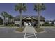 Entrance to the community with decorative landscaping and ample parking at 1097 Briar Rose Ln, Ladson, SC 29456