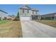 Charming two-story home with a long driveway and well-maintained lawn at 1097 Briar Rose Ln, Ladson, SC 29456
