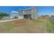 Charming two-story home featuring a well-manicured lawn, attached garage, and quaint front porch at 1097 Briar Rose Ln, Ladson, SC 29456
