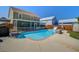 Backyard pool with slide, patio, landscaping, and screened-in porch at 1097 Briar Rose Ln, Ladson, SC 29456