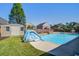 Backyard swimming pool with slide, landscaping, and shed in a fenced-in yard at 1097 Briar Rose Ln, Ladson, SC 29456