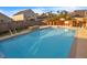 Inviting backyard pool surrounded by a patio, a waterfall feature, and privacy fence at 1097 Briar Rose Ln, Ladson, SC 29456