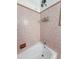 Cozy bathtub with a shower featuring decorative wall tiles, offering a relaxing and functional space at 114 California Ave, Moncks Corner, SC 29461