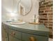 Bathroom vanity with an oval sink, gold faucet, and decor on a neutral countertop at 114 California Ave, Moncks Corner, SC 29461