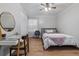 Cozy bedroom with natural light, hardwood floors, and a classic writing desk at 114 California Ave, Moncks Corner, SC 29461