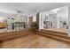 Spacious dining area with hardwood floors, large table, and access to outdoor lighting at 114 California Ave, Moncks Corner, SC 29461