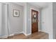 Inviting entryway with beautiful wood-look floors, a decorative door, and tasteful decor at 114 California Ave, Moncks Corner, SC 29461