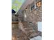 Exterior of the home with a brick facade, deck, stairs, and adjacent landscaping at 114 California Ave, Moncks Corner, SC 29461