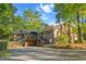 Brick home featuring an expansive back deck, and lush landscape that offer a serene setting at 114 California Ave, Moncks Corner, SC 29461