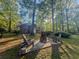 Enjoy evenings at the outdoor fire pit with chairs and wooded scenery. The perfect space to relax! at 114 California Ave, Moncks Corner, SC 29461