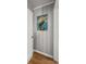 Welcoming hallway featuring wainscoting wall paneling and an eye-catching pelican painting adding character to the space at 114 California Ave, Moncks Corner, SC 29461