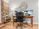 Bright home office featuring hardwood floors, a desk, and a decorative wall mirror at 114 California Ave, Moncks Corner, SC 29461