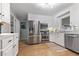 Bright kitchen featuring stainless steel appliances, ample counter space, and white cabinets at 114 California Ave, Moncks Corner, SC 29461