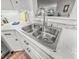 Close-up of a stainless steel kitchen sink with modern faucet and white countertop at 114 California Ave, Moncks Corner, SC 29461