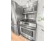 Stainless steel oven and microwave with stainless steel refrigerator and backsplash at 114 California Ave, Moncks Corner, SC 29461