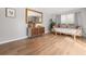 Spacious living room with laminate floors, a large mirror, and a modern accent cabinet at 114 California Ave, Moncks Corner, SC 29461