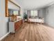 Stylish living room with laminate floors, a large mirror, and neutral decor at 114 California Ave, Moncks Corner, SC 29461