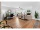 Cozy living room featuring a fireplace, hardwood floors, and comfortable seating area at 114 California Ave, Moncks Corner, SC 29461