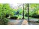 Tranquil yard with mature trees, manicured bushes, and ample shaded areas at 114 California Ave, Moncks Corner, SC 29461
