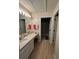Well-lit bathroom featuring a sink with vanity and a separate shower room at 1220 Apex Ln, Charleston, SC 29412