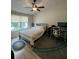 Comfortable bedroom with a ceiling fan, a large window, a spacious layout, and laminate wood flooring at 1220 Apex Ln, Charleston, SC 29412