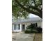Charming single-story home featuring white siding, a grey roof, and mature landscaping at 1220 Apex Ln, Charleston, SC 29412