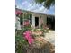 Charming home featuring blooming roses in the front yard, enhancing curb appeal and a welcoming ambiance at 1220 Apex Ln, Charleston, SC 29412