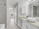 Bright bathroom featuring modern fixtures, granite countertops, and an adjoining bedroom at 1300 Park West Blvd # 101, Mount Pleasant, SC 29466