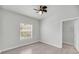 Bedroom with a window, ceiling fan, and a walk-in closet at 1300 Park West Blvd # 101, Mount Pleasant, SC 29466