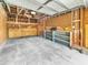 Functional garage space with shelving, storage, and a concrete floor for parking or projects at 1300 Park West Blvd # 101, Mount Pleasant, SC 29466