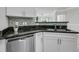 Modern kitchen featuring stainless steel appliances, granite countertops and white cabinets at 1300 Park West Blvd # 101, Mount Pleasant, SC 29466