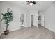 Spacious living room featuring wood-look flooring and bright, neutral paint at 1300 Park West Blvd # 101, Mount Pleasant, SC 29466