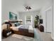 Modern bedroom with hardwood floors, large bed, TV, and natural light at 1300 Park West Blvd # 101, Mount Pleasant, SC 29466