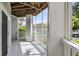 The private outdoor patio features a wood ceiling and provides shade from the outdoor environment at 1300 Park West Blvd # 101, Mount Pleasant, SC 29466