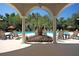 View of the refreshing pool and lounge chairs, inviting residents to relax and enjoy the outdoors at 1300 Park West Blvd # 101, Mount Pleasant, SC 29466