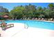 A serene pool area with chairs, offering a perfect spot for relaxation and leisurely swimming at 1300 Park West Blvd # 101, Mount Pleasant, SC 29466