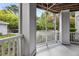 The porch offers a tranquil space to enjoy the surrounding greenery and natural landscape at 1300 Park West Blvd # 101, Mount Pleasant, SC 29466