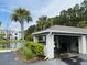 Community car wash station with vacuum and tire inflation system on a landscaped lot with a pond at 1300 Park West Blvd # 406, Mount Pleasant, SC 29466