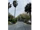 Gated community entrance surrounded by palm trees, ensuring privacy and security for residents at 1300 Park West Blvd # 406, Mount Pleasant, SC 29466